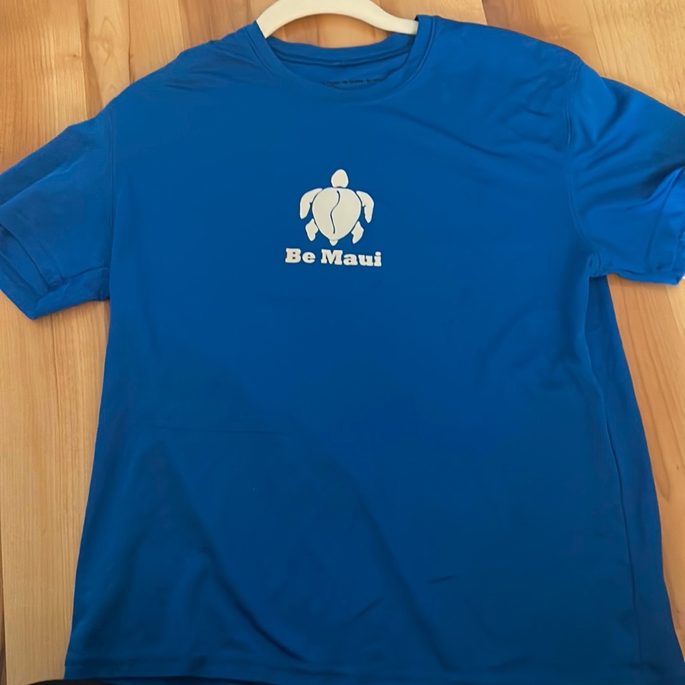 Blue swim shirt/rash guard. Size is a youth L, In perfect condition barley worn.